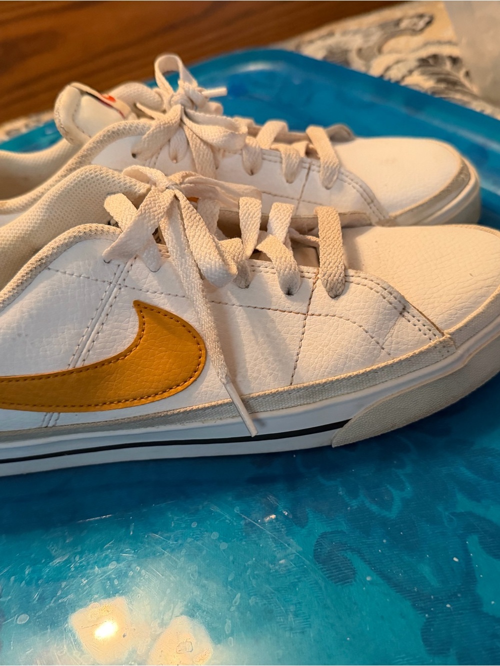 Nike White Low-Top Sneakers with Yellow Swoosh